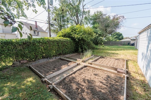3817 Washington Park Blvd, Newburgh Heights, OH 44105 - fenced backyard with a vegetable garden