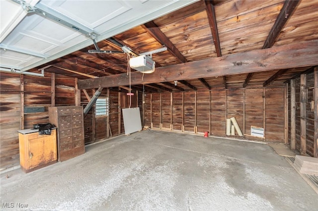 3817 Washington Park Blvd, Newburgh Heights, OH 44105 - garage featuring a garage door opener and wood walls
