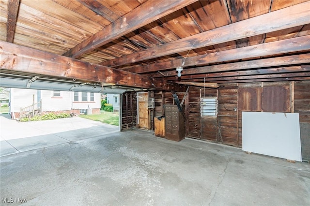 3817 Washington Park Blvd, Newburgh Heights, OH 44105 - garage with freestanding refrigerator and wood ceiling