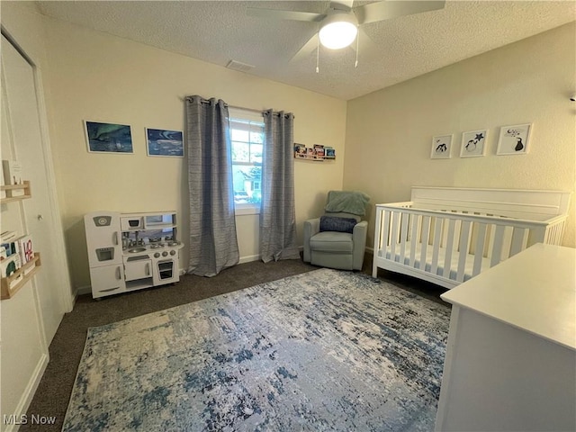 35958 Hiawatha Blvd, Eastlake, OH 44095 - bedroom featuring a textured ceiling, a crib, carpet flooring, and a ceiling fan