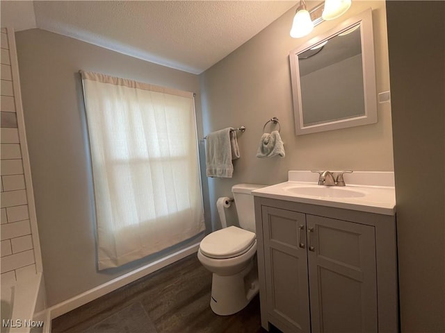 35958 Hiawatha Blvd, Eastlake, OH 44095 - full bathroom with vanity, wood finished floors, a textured ceiling, a bath, and a shower