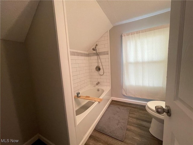 35958 Hiawatha Blvd, Eastlake, OH 44095 - bathroom featuring vaulted ceiling, wood finished floors, shower / washtub combination, and a textured ceiling
