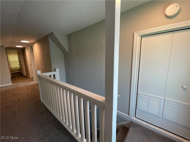 35958 Hiawatha Blvd, Eastlake, OH 44095 - hallway with an upstairs landing, a textured wall, and carpet flooring