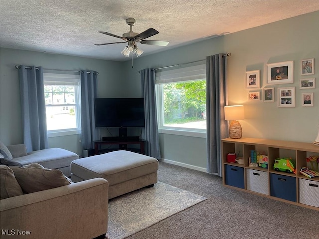 35958 Hiawatha Blvd, Eastlake, OH 44095 - carpeted living room featuring a textured ceiling and a ceiling fan