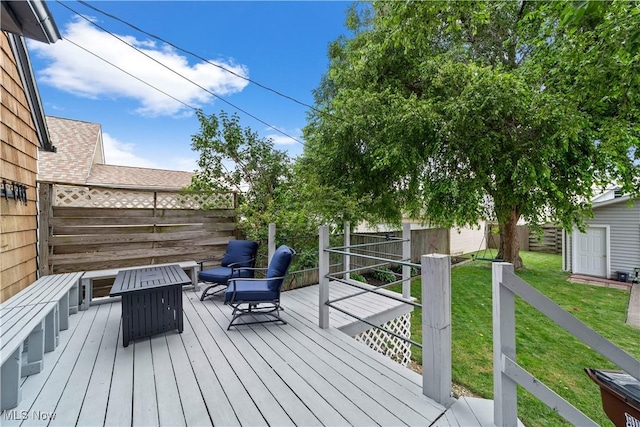 7604 Spring Garden Rd, Parma, OH 44129 - deck with a fenced backyard, an outdoor structure, and a fire pit
