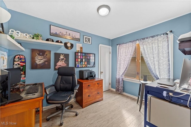 7604 Spring Garden Rd, Parma, OH 44129 - home office with light wood finished floors and baseboards