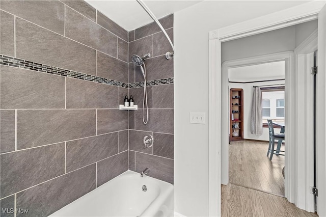 7604 Spring Garden Rd, Parma, OH 44129 - full bathroom featuring shower / bathtub combination and wood finished floors