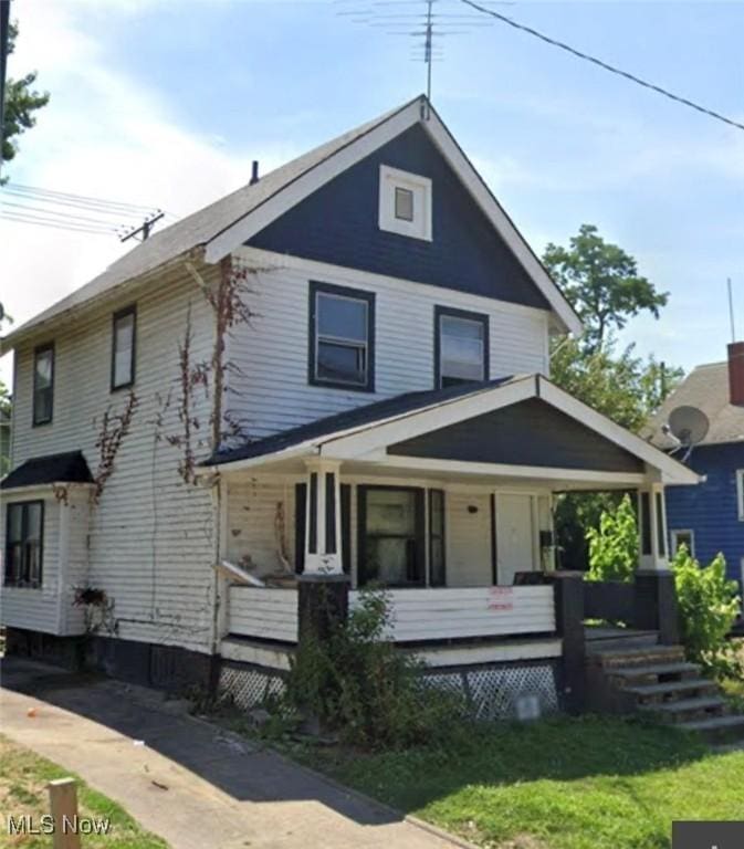 14600 Potomac Ave, East Cleveland, OH 44112 - traditional style home with a porch and a front lawn