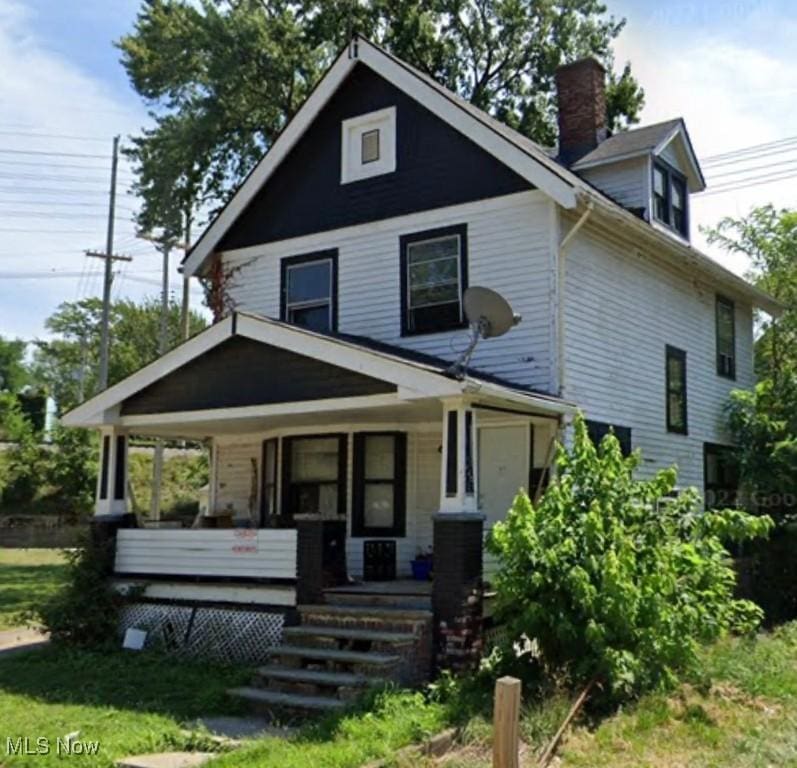 14600 Potomac Ave, East Cleveland, OH 44112 - view of front of property featuring covered porch and a chimney