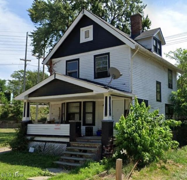 14600 Potomac Ave, East Cleveland, OH 44112 - view of front of property featuring covered porch and a chimney