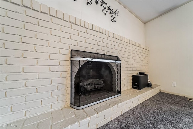 2640 Fleger Dr, Parma, OH 44134 - detailed view of a brick fireplace and carpet flooring