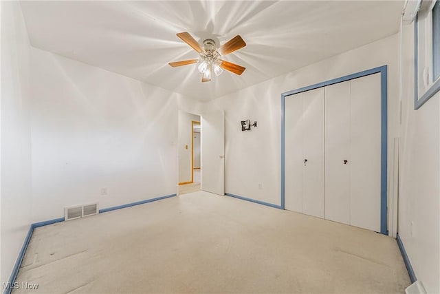 2640 Fleger Dr, Parma, OH 44134 - unfurnished bedroom with carpet flooring, a closet, and a ceiling fan