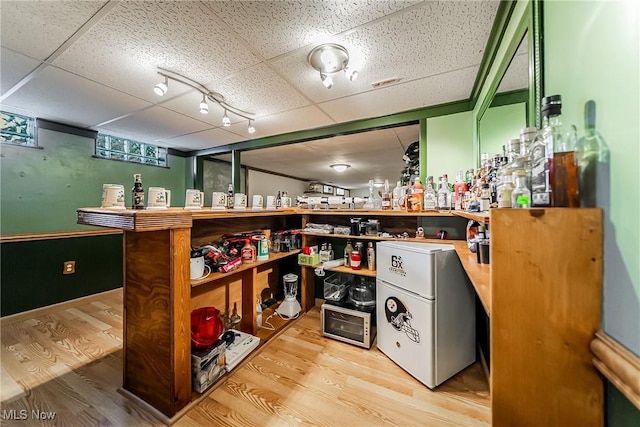 2640 Fleger Dr, Parma, OH 44134 - bar featuring refrigerator, light wood finished floors, a drop ceiling, and track lighting