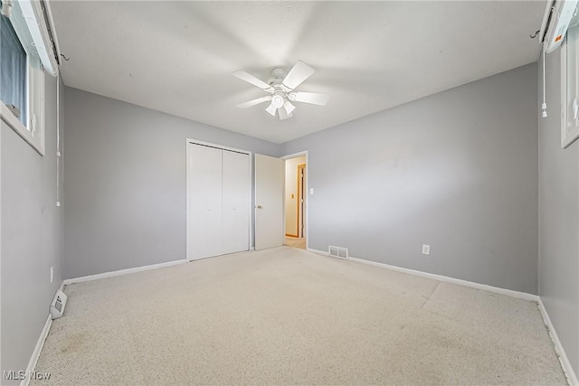2640 Fleger Dr, Parma, OH 44134 - unfurnished bedroom featuring carpet flooring, a closet, and ceiling fan