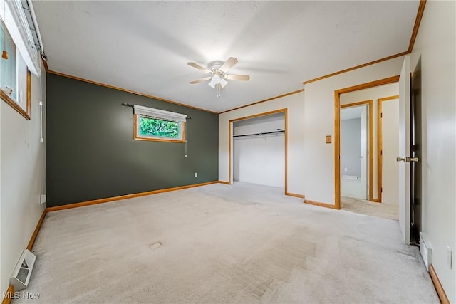 2640 Fleger Dr, Parma, OH 44134 - unfurnished bedroom featuring ornamental molding, carpet, a closet, and ceiling fan