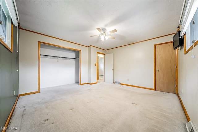 2640 Fleger Dr, Parma, OH 44134 - unfurnished bedroom featuring ornamental molding, carpet, a closet, and a ceiling fan