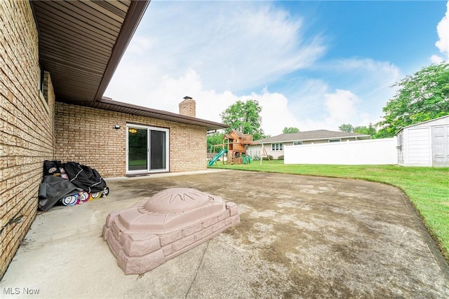 2640 Fleger Dr, Parma, OH 44134 - view of yard featuring a playground, a patio, and a storage shed