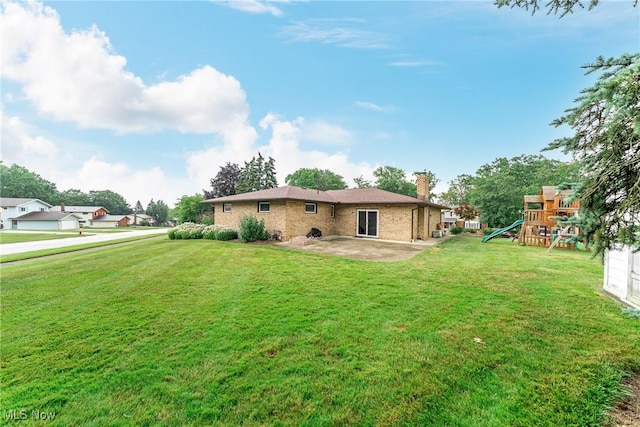 2640 Fleger Dr, Parma, OH 44134 - back of property featuring a chimney, a patio area, a playground, and a yard