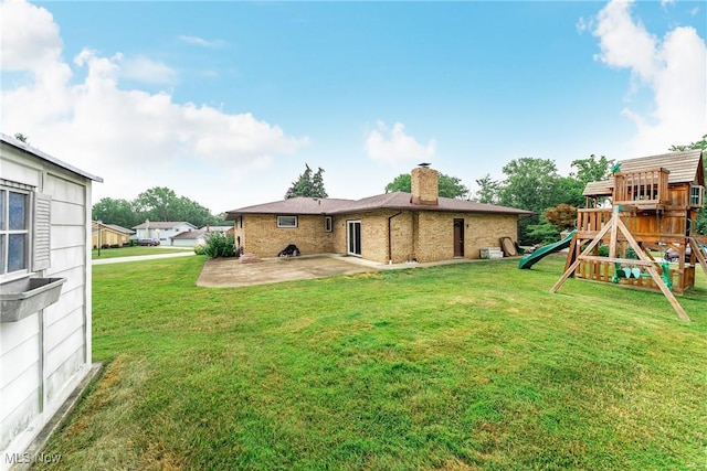 2640 Fleger Dr, Parma, OH 44134 - rear view of property with a patio, a chimney, a lawn, a playground, and brick siding