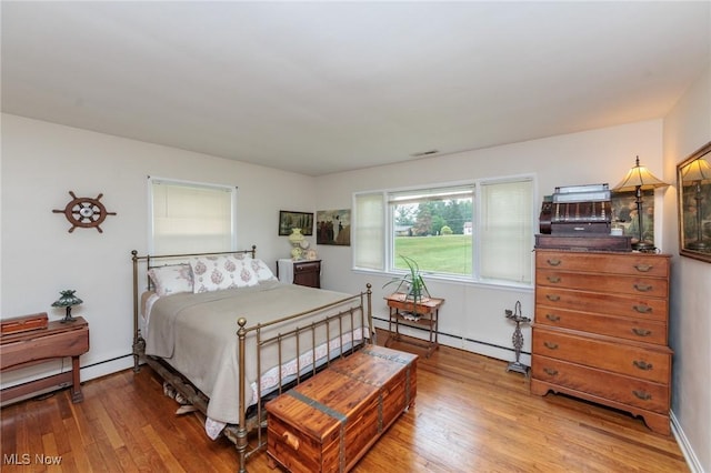 11756 Clarke Rd, Columbia Station, OH 44028 - bedroom featuring light wood-style floors and baseboard heating