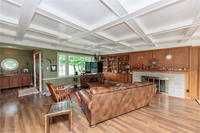 11756 Clarke Rd, Columbia Station, OH 44028 - living area with coffered ceiling, wood finished floors, a glass covered fireplace, beam ceiling, and baseboard heating