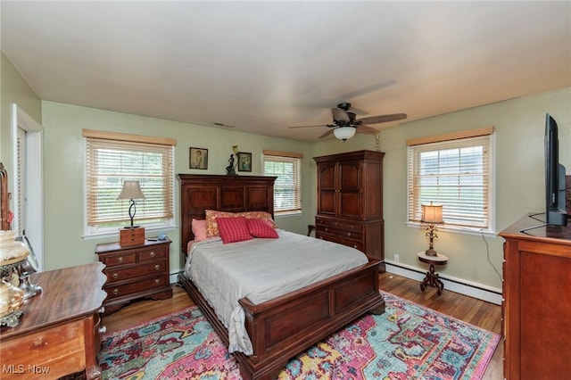 11756 Clarke Rd, Columbia Station, OH 44028 - bedroom with wood finished floors, multiple windows, and ceiling fan