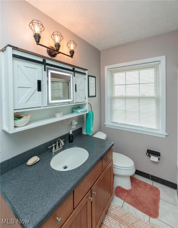 11756 Clarke Rd, Columbia Station, OH 44028 - bathroom with vanity, tile patterned floors, and a textured ceiling