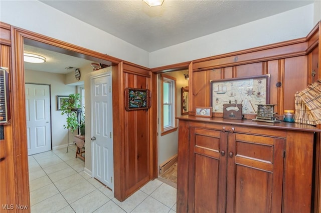 11756 Clarke Rd, Columbia Station, OH 44028 - hallway featuring light tile patterned floors and a textured ceiling