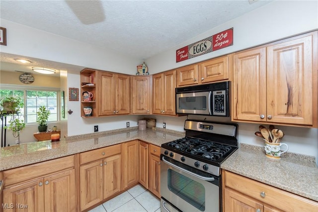 11756 Clarke Rd, Columbia Station, OH 44028 - kitchen with appliances with stainless steel finishes, light tile patterned flooring, a textured ceiling, light stone counters, and open shelves