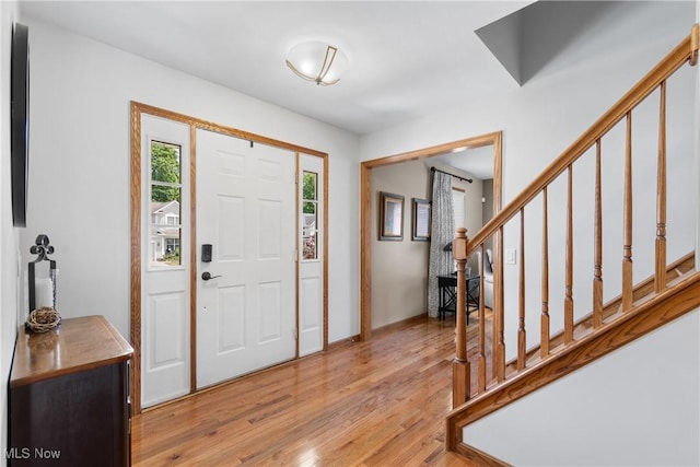 3100 Ravineview Cir, Stow, OH 44224 - foyer featuring stairway and light wood-style flooring
