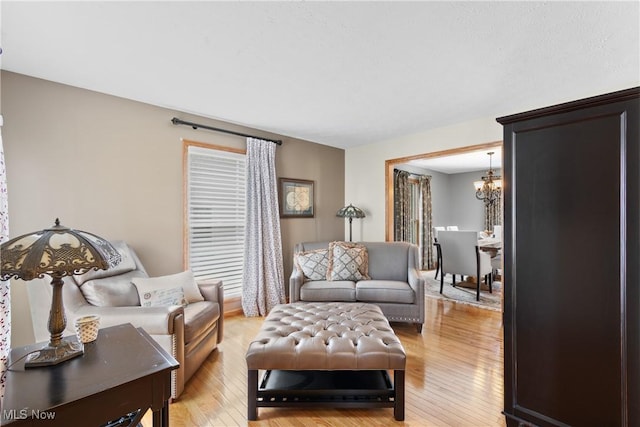 3100 Ravineview Cir, Stow, OH 44224 - living area with a chandelier, light wood-style flooring, and plenty of natural light