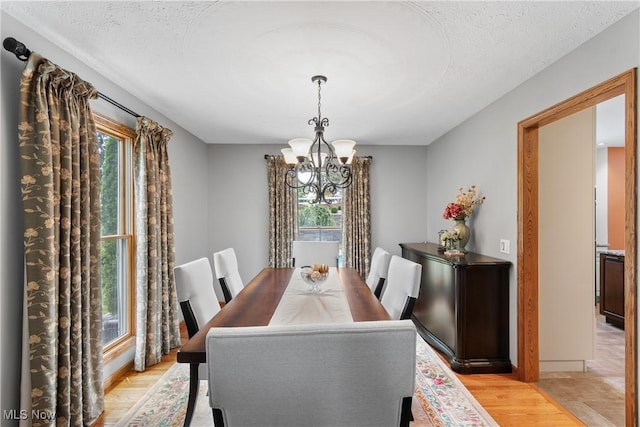 3100 Ravineview Cir, Stow, OH 44224 - dining room featuring a chandelier and light wood-style floors