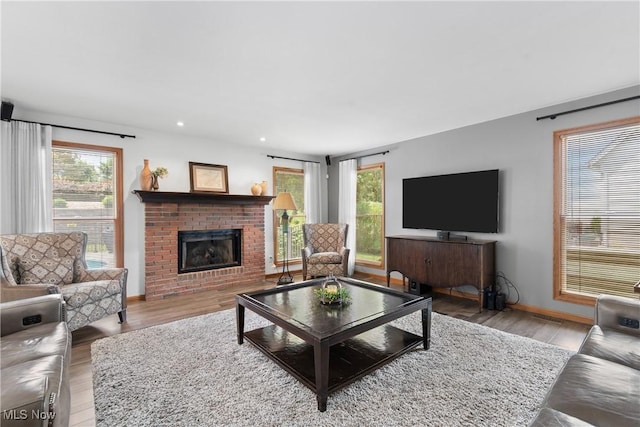 3100 Ravineview Cir, Stow, OH 44224 - living room with healthy amount of natural light, a fireplace, wood finished floors, and recessed lighting