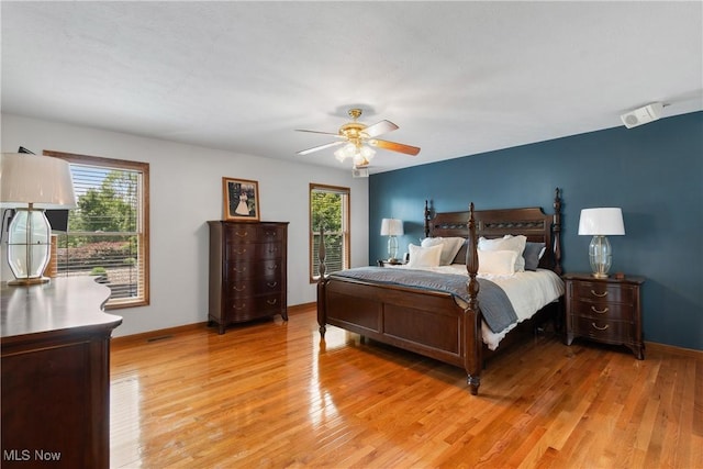 3100 Ravineview Cir, Stow, OH 44224 - bedroom with multiple windows, light wood-type flooring, and ceiling fan