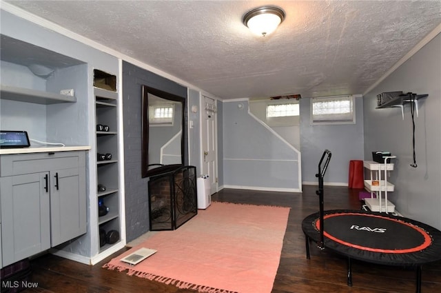 3921 Grosvenor Rd, South Euclid, OH 44118 - game room with a textured ceiling, wood finished floors, and built in features