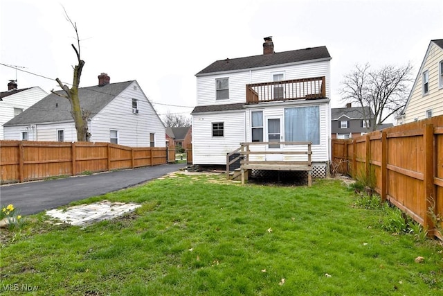 3921 Grosvenor Rd, South Euclid, OH 44118 - rear view of property featuring a balcony, a fenced backyard, a deck, and a chimney