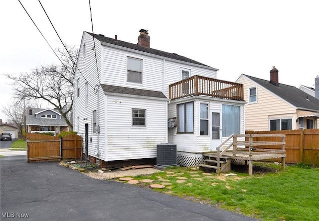 3921 Grosvenor Rd, South Euclid, OH 44118 - rear view of house featuring a balcony, a chimney, a deck, and roof with shingles
