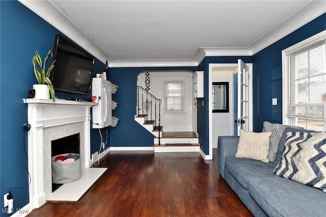 3921 Grosvenor Rd, South Euclid, OH 44118 - living area with healthy amount of natural light, wood finished floors, stairs, ornamental molding, and a high end fireplace