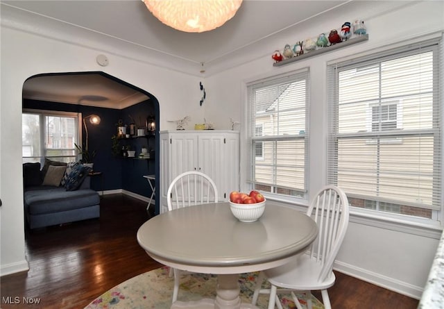 3921 Grosvenor Rd, South Euclid, OH 44118 - dining room with arched walkways and wood finished floors