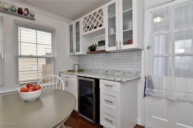 3921 Grosvenor Rd, South Euclid, OH 44118 - kitchen with wine cooler, open shelves, tasteful backsplash, white cabinetry, and glass insert cabinets