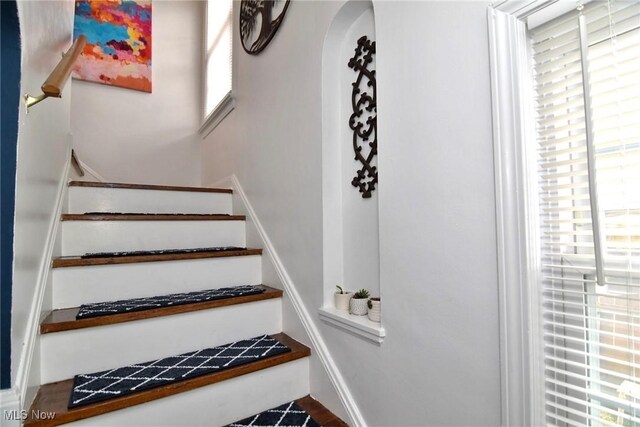 3921 Grosvenor Rd, South Euclid, OH 44118 - stairs featuring arched walkways and baseboards