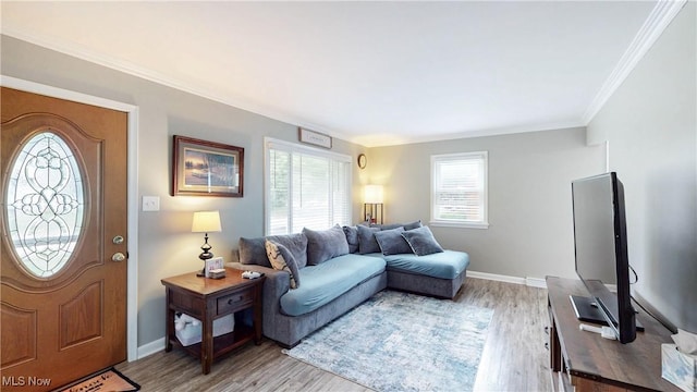 87 Holcomb Ave, Mogadore, OH 44260 - living area with healthy amount of natural light, light wood-style floors, and crown molding