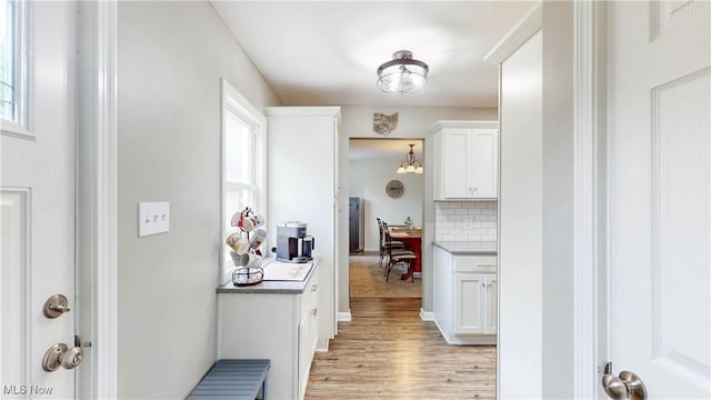 87 Holcomb Ave, Mogadore, OH 44260 - hallway with healthy amount of natural light and light wood finished floors
