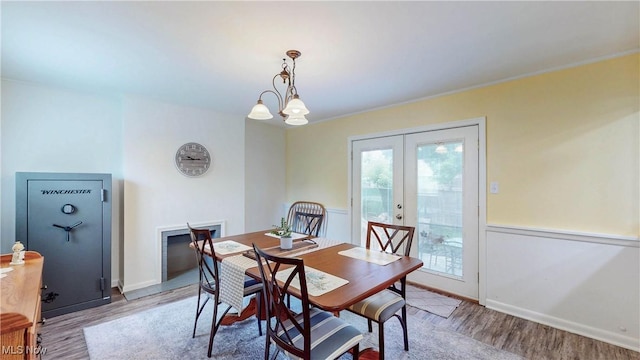 87 Holcomb Ave, Mogadore, OH 44260 - dining space with french doors and light wood-style flooring
