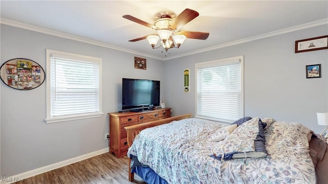 87 Holcomb Ave, Mogadore, OH 44260 - bedroom featuring light wood-type flooring, ornamental molding, multiple windows, and a ceiling fan