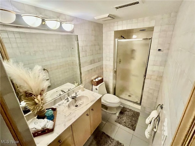 23547 Quail Holw, Westlake, OH 44145 - bathroom with tile walls, tile patterned flooring, vanity, and a stall shower
