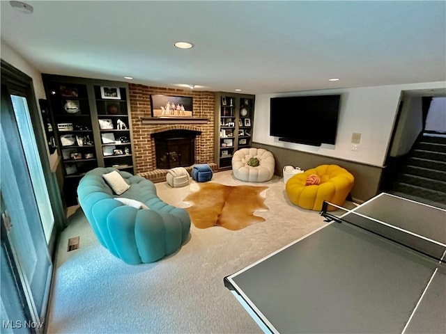 23547 Quail Holw, Westlake, OH 44145 - carpeted living area featuring a fireplace, stairs, built in features, and recessed lighting