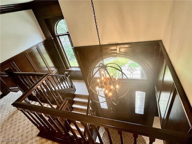 23547 Quail Holw, Westlake, OH 44145 - detailed view of a chandelier, a decorative wall, and carpet floors