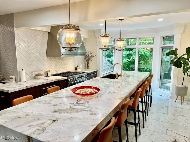 23547 Quail Holw, Westlake, OH 44145 - kitchen featuring a chandelier, light stone counters, a spacious island, light marble finish flooring, and tasteful backsplash