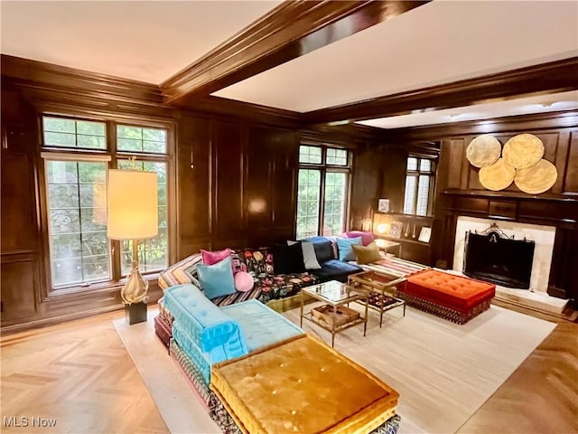 23547 Quail Holw, Westlake, OH 44145 - sitting room featuring a high end fireplace, beam ceiling, wood walls, and ornamental molding